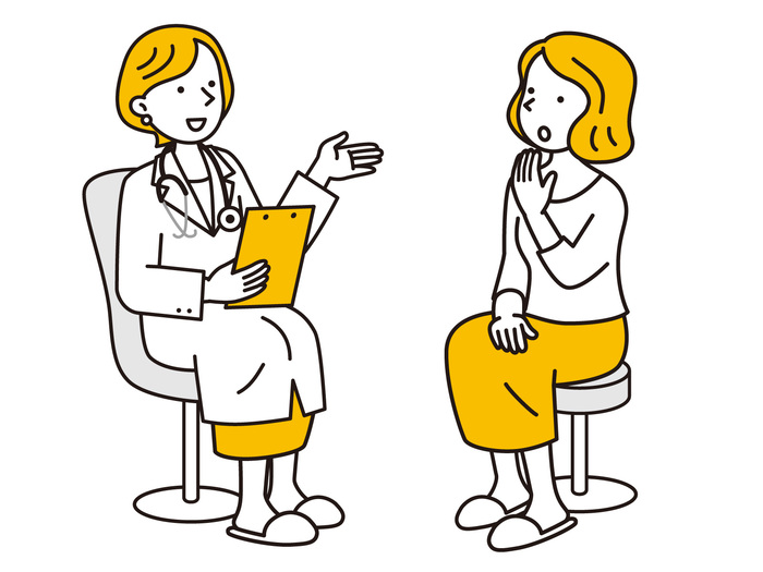患者に説明する女性医師のイラスト